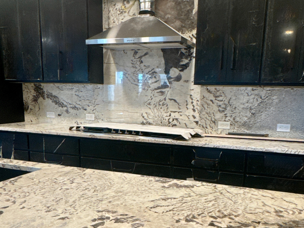 Matching stone backsplash and countertops